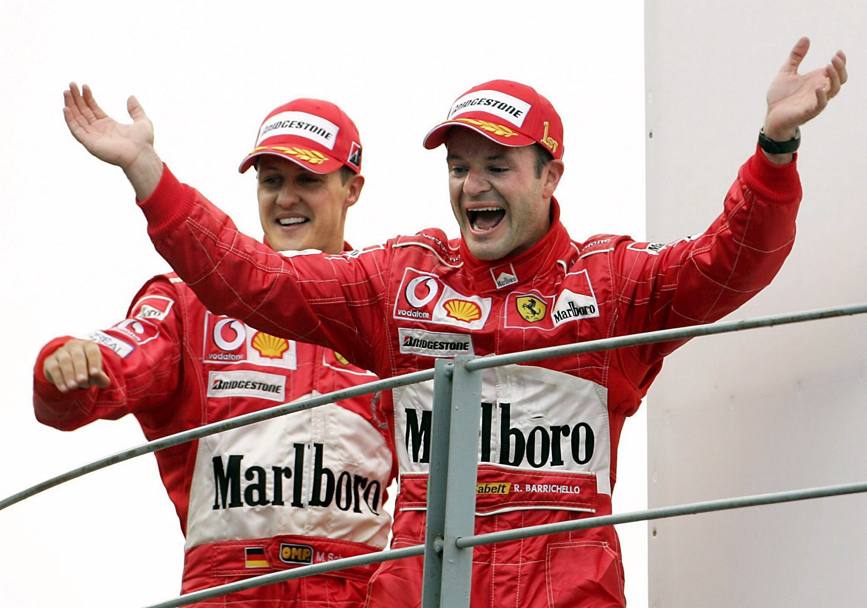 2004: Rubens Barrichello (1) e MIchael Schumacher (2) festeggiano il trionfo Ferrari
